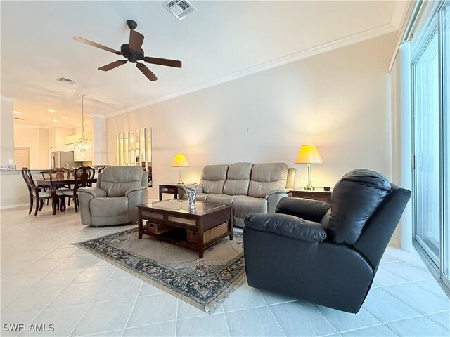 8736 Naples Heritage Dr, Naples, FL 34112 - living area featuring tile patterned flooring, a ceiling fan, ornamental molding, and baseboards