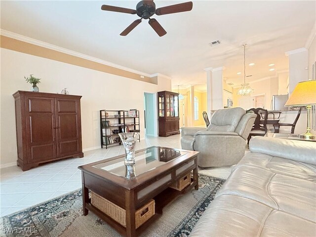 8736 Naples Heritage Dr, Naples, FL 34112 - living room featuring a ceiling fan, baseboards, crown molding, light tile patterned floors, and a chandelier