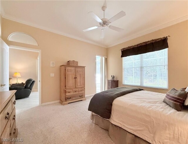 8736 Naples Heritage Dr, Naples, FL 34112 - bedroom featuring ornamental molding, light carpet, a ceiling fan, and baseboards