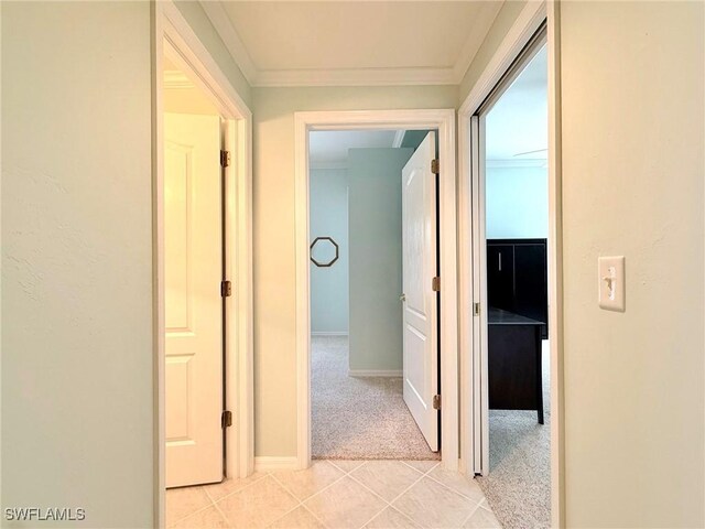 8736 Naples Heritage Dr, Naples, FL 34112 - hall featuring light colored carpet, light tile patterned floors, ornamental molding, and baseboards