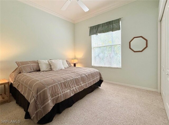 8736 Naples Heritage Dr, Naples, FL 34112 - carpeted bedroom with ornamental molding, baseboards, a closet, and a ceiling fan