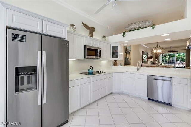 2365 Hidden Lake Dr Unit 4309, Naples, FL 34112 - kitchen featuring appliances with stainless steel finishes, a sink, ceiling fan, crown molding, and white cabinets