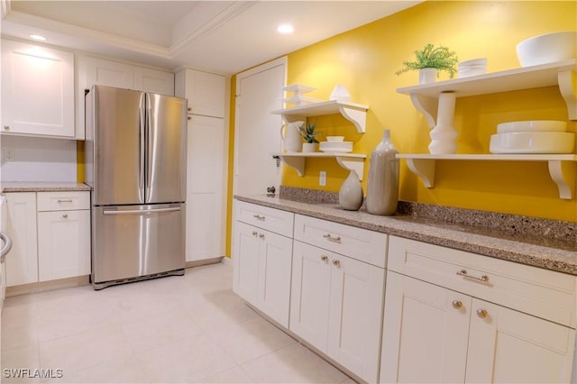 7150 Estero Blvd Unit 403, Fort Myers Beach, FL 33931 - kitchen featuring open shelves, freestanding refrigerator, white cabinets, recessed lighting, and light stone counters