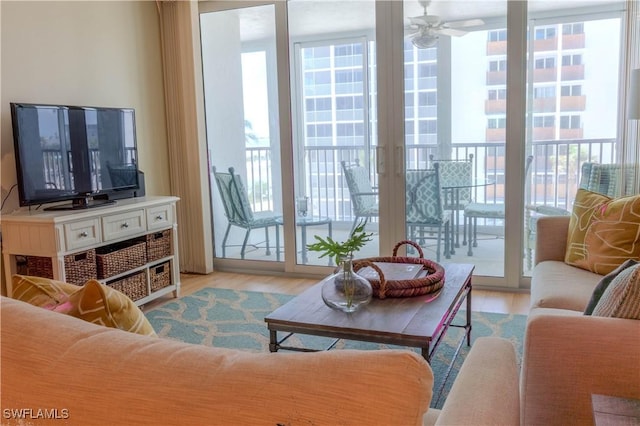 7150 Estero Blvd Unit 403, Fort Myers Beach, FL 33931 - living room featuring plenty of natural light, ceiling fan, and wood finished floors