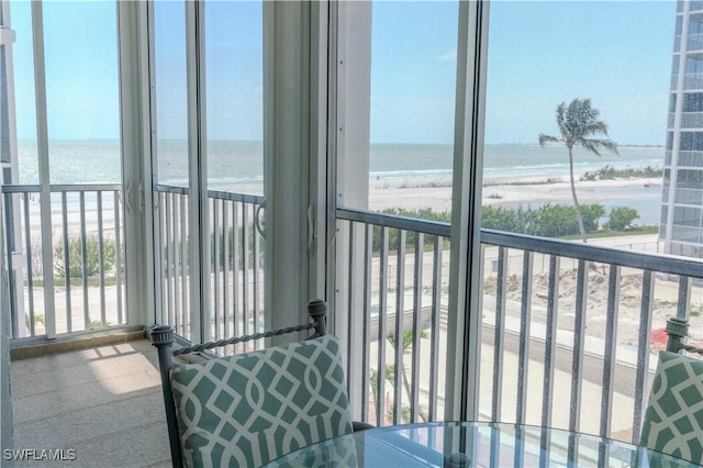 7150 Estero Blvd Unit 403, Fort Myers Beach, FL 33931 - sunroom / solarium featuring healthy amount of natural light and view of water and beach