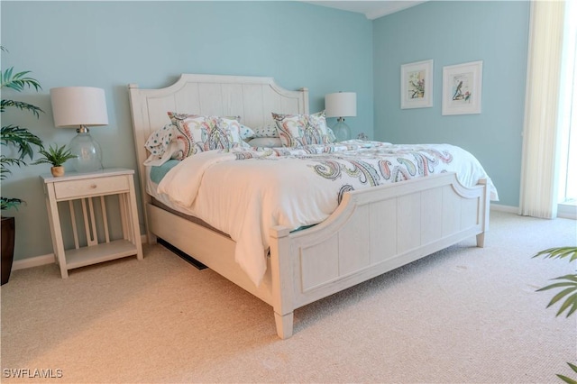 7150 Estero Blvd Unit 403, Fort Myers Beach, FL 33931 - bedroom with light carpet and baseboards