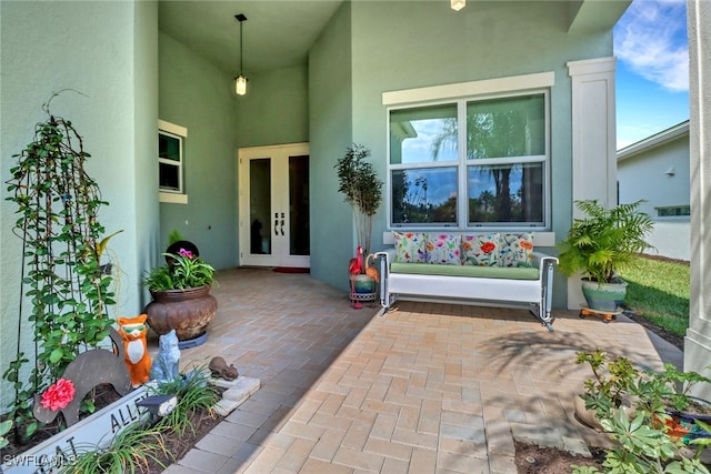 16712 Gilroy St, Bonita Springs, FL 34135 - view of exterior entry featuring french doors and stucco siding