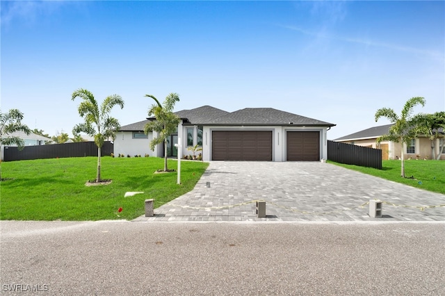 336 NE 25th St, Cape Coral, FL 33909 - view of front of property featuring an attached garage and decorative driveway