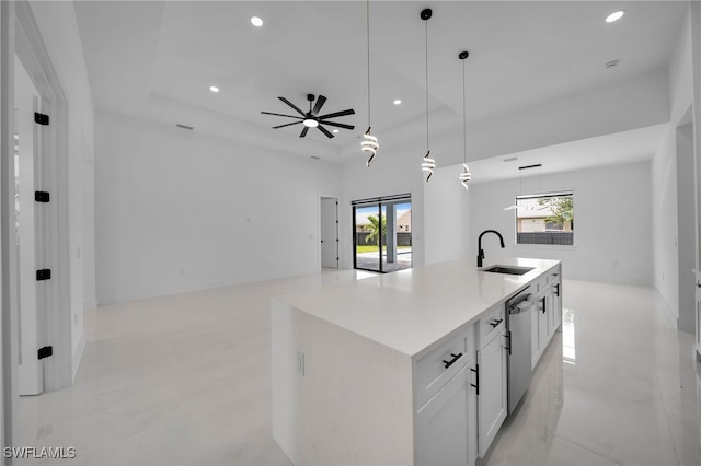 336 NE 25th St, Cape Coral, FL 33909 - kitchen featuring a sink, stainless steel dishwasher, recessed lighting, white cabinetry, and decorative light fixtures