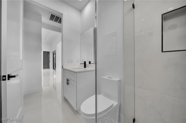 336 NE 25th St, Cape Coral, FL 33909 - bathroom with vanity, toilet, a walk in shower, tile patterned flooring, and baseboards