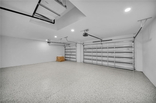 336 NE 25th St, Cape Coral, FL 33909 - garage featuring a garage door opener and recessed lighting