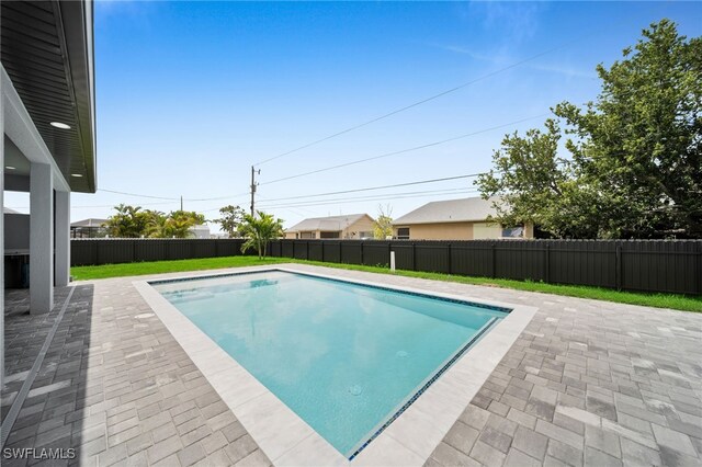 336 NE 25th St, Cape Coral, FL 33909 - view of swimming pool with a patio