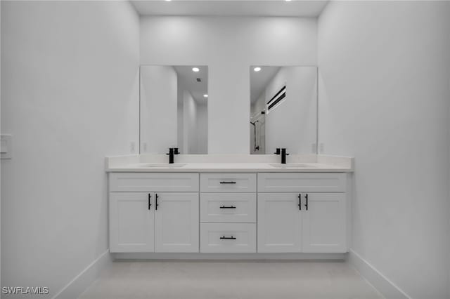 336 NE 25th St, Cape Coral, FL 33909 - full bath with baseboards, double vanity, and recessed lighting