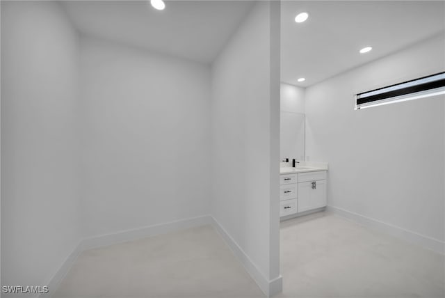 336 NE 25th St, Cape Coral, FL 33909 - bathroom with vanity, recessed lighting, and baseboards