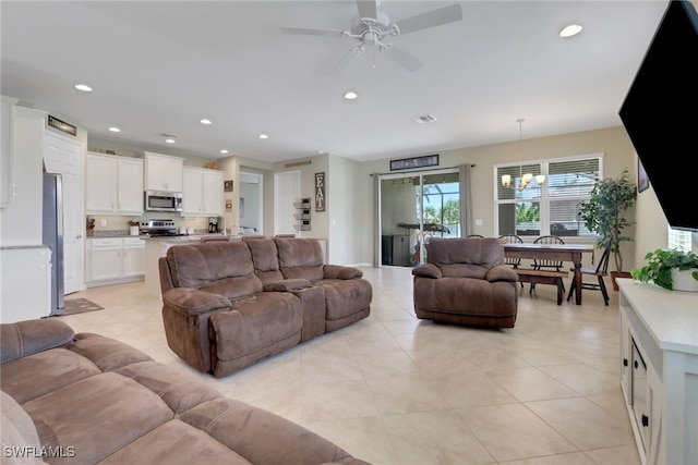 2510 SW 24th Ct, Cape Coral, FL 33914 - living room with a chandelier, a ceiling fan, recessed lighting, and light tile patterned floors