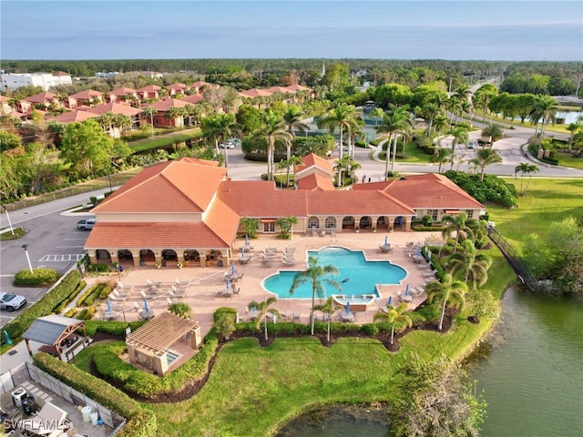 6670 Huntington Lakes Cir Unit 104, Naples, FL 34119 - aerial perspective of suburban area with a pool area and a nearby body of water