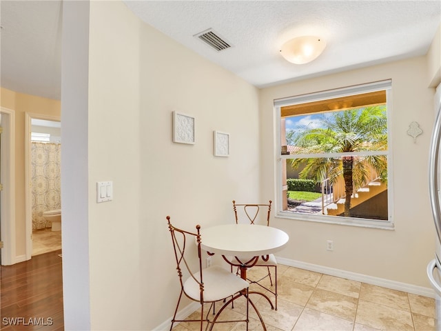 6670 Huntington Lakes Cir Unit 104, Naples, FL 34119 - dining space featuring baseboards