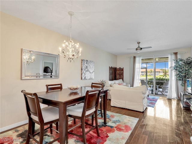 6670 Huntington Lakes Cir Unit 104, Naples, FL 34119 - dining space featuring wood finished floors, a chandelier, and a ceiling fan
