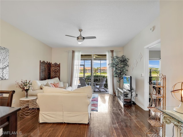 6670 Huntington Lakes Cir Unit 104, Naples, FL 34119 - living area with ceiling fan, dark wood-type flooring, and baseboards