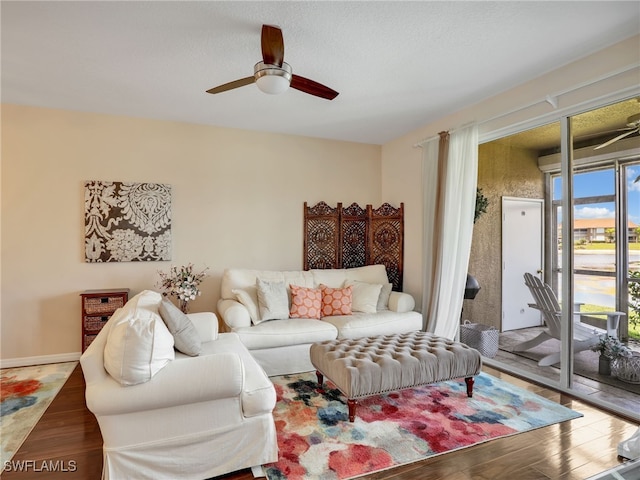 6670 Huntington Lakes Cir Unit 104, Naples, FL 34119 - living room with ceiling fan and wood finished floors