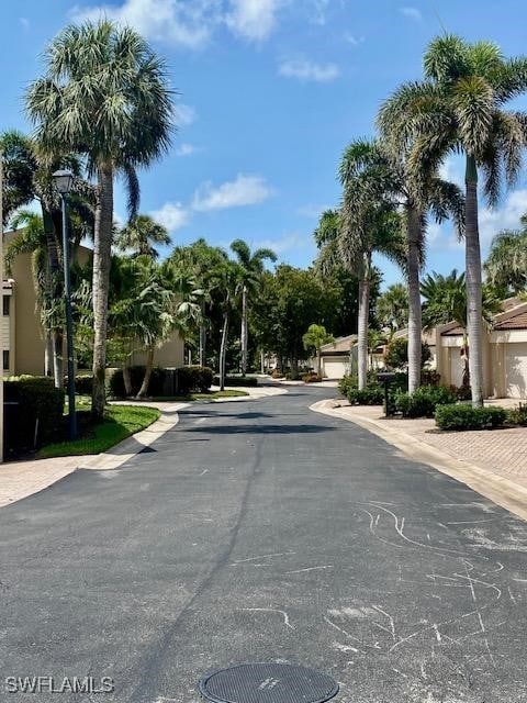 5015 Harbortown Ln Unit 204, Fort Myers, FL 33919 - view of asphalt road featuring street lights