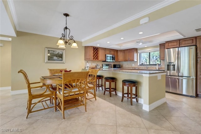 5015 Harbortown Ln Unit 204, Fort Myers, FL 33919 - dining area with a tray ceiling, ornamental molding, baseboards, light tile patterned flooring, and recessed lighting