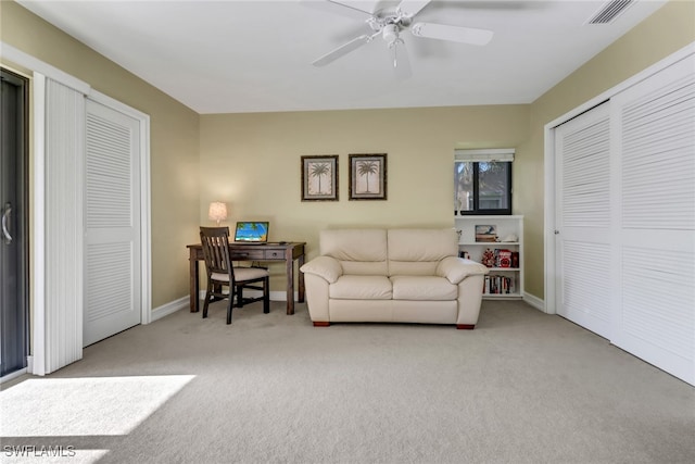 5015 Harbortown Ln Unit 204, Fort Myers, FL 33919 - living area featuring carpet, baseboards, and ceiling fan