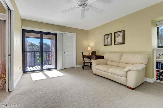 5015 Harbortown Ln Unit 204, Fort Myers, FL 33919 - living room with carpet, baseboards, and a ceiling fan