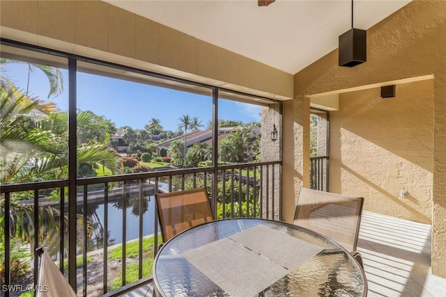 5015 Harbortown Ln Unit 204, Fort Myers, FL 33919 - sunroom with vaulted ceiling, healthy amount of natural light, and a water view