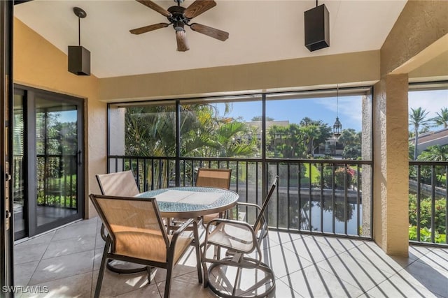 5015 Harbortown Ln Unit 204, Fort Myers, FL 33919 - sunroom featuring tile patterned floors, high vaulted ceiling, and a textured wall