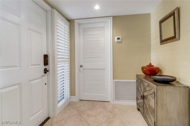 5015 Harbortown Ln Unit 204, Fort Myers, FL 33919 - entrance foyer with light tile patterned floors, baseboards, and recessed lighting