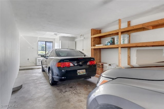 5015 Harbortown Ln Unit 204, Fort Myers, FL 33919 - garage featuring independent washer and dryer