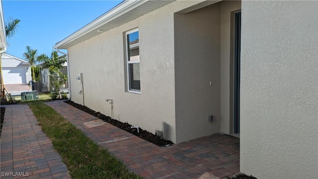 986 Enbrook Loop, Naples, FL 34114 - view of side of home with stucco siding