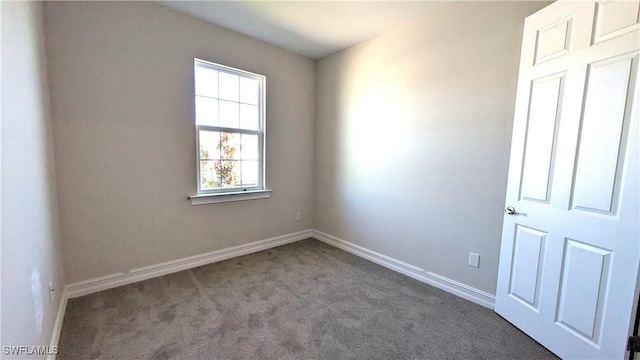 986 Enbrook Loop, Naples, FL 34114 - carpeted empty room with baseboards
