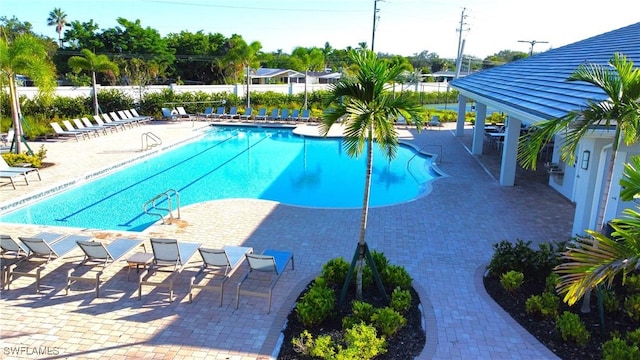 986 Enbrook Loop, Naples, FL 34114 - community pool with a patio area