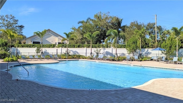 986 Enbrook Loop, Naples, FL 34114 - community pool with a patio area