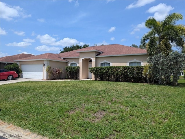 2543 Nature Pointe Loop, Fort Myers, FL 33905 - mediterranean / spanish home featuring stucco siding, a front yard, a garage, and driveway