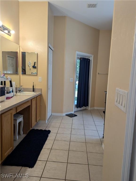 2543 Nature Pointe Loop, Fort Myers, FL 33905 - bathroom featuring tile patterned flooring, vanity, and baseboards