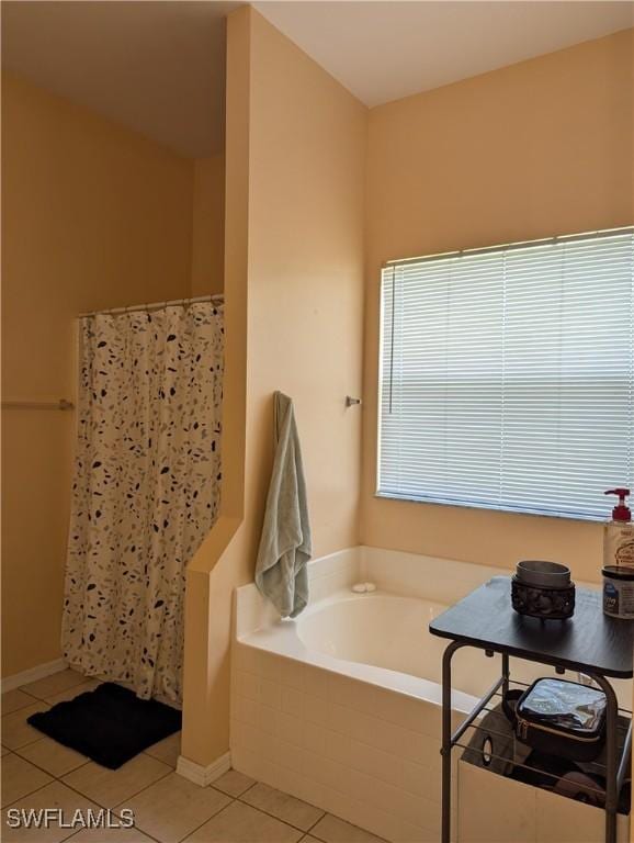 2543 Nature Pointe Loop, Fort Myers, FL 33905 - bathroom with tile patterned floors, a bath, and curtained shower