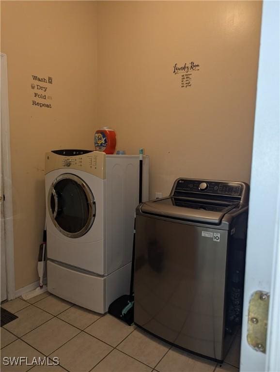 2543 Nature Pointe Loop, Fort Myers, FL 33905 - washroom with independent washer and dryer and light tile patterned flooring