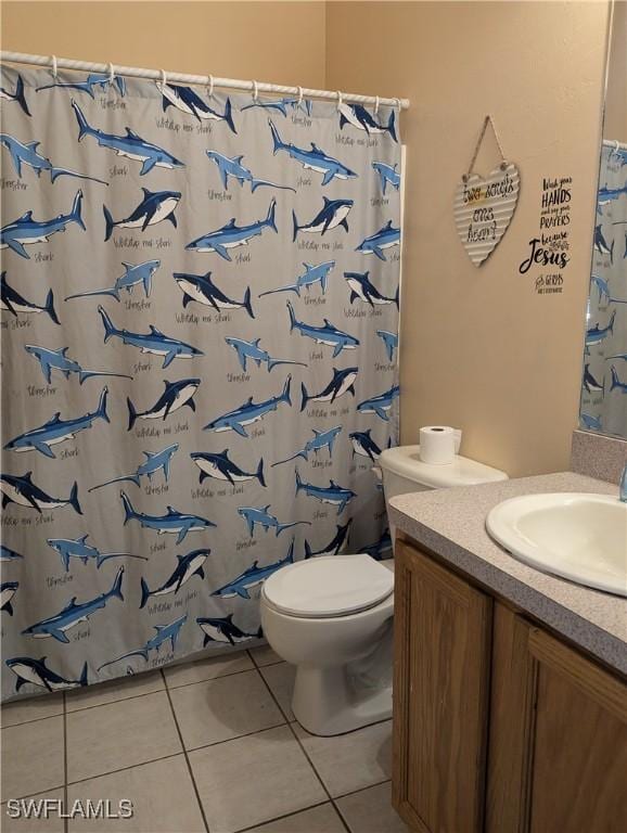 2543 Nature Pointe Loop, Fort Myers, FL 33905 - bathroom with tile patterned floors, toilet, vanity, and curtained shower