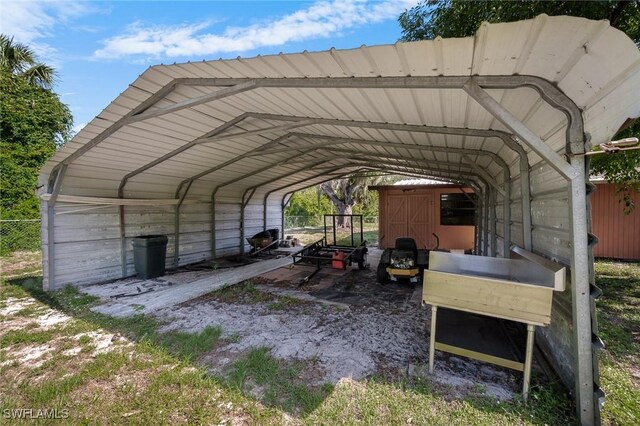 7384 Coon Rd, North Fort Myers, FL 33917 - view of parking featuring a detached carport and fence
