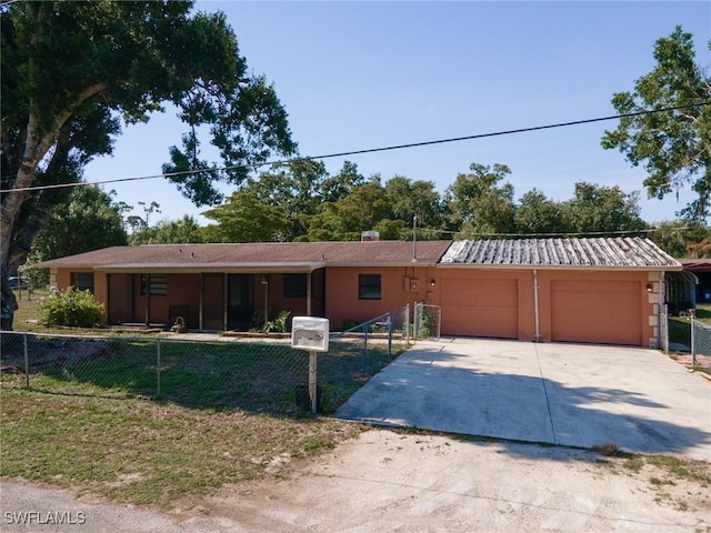 7384 Coon Rd, North Fort Myers, FL 33917 - ranch-style house with concrete driveway, an attached garage, and stucco siding