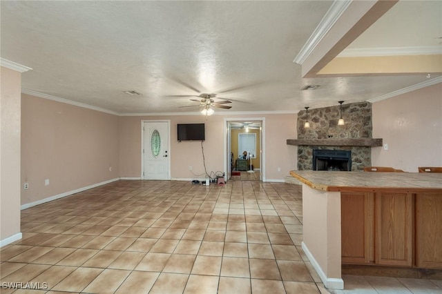 7384 Coon Rd, North Fort Myers, FL 33917 - unfurnished living room featuring a fireplace, ceiling fan, ornamental molding, light tile patterned floors, and baseboards