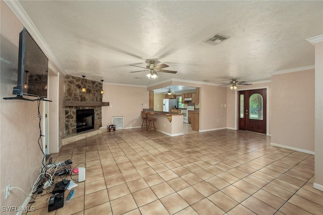7384 Coon Rd, North Fort Myers, FL 33917 - unfurnished living room featuring a ceiling fan, light tile patterned floors, a stone fireplace, ornamental molding, and baseboards