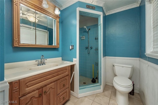 7384 Coon Rd, North Fort Myers, FL 33917 - bathroom with a stall shower, tile patterned flooring, toilet, vanity, and a wainscoted wall