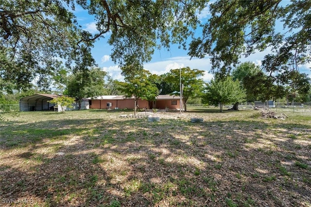 7384 Coon Rd, North Fort Myers, FL 33917 - view of yard with fence and a detached carport