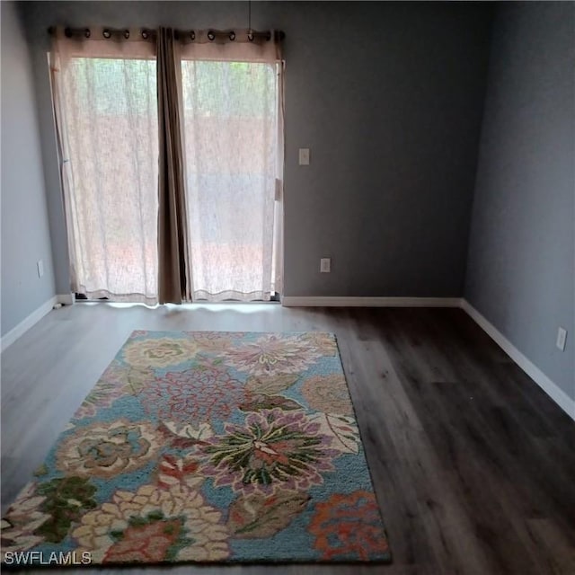 2925 Winkler Ave Unit 906, Fort Myers, FL 33916 - unfurnished room with wood finished floors and baseboards
