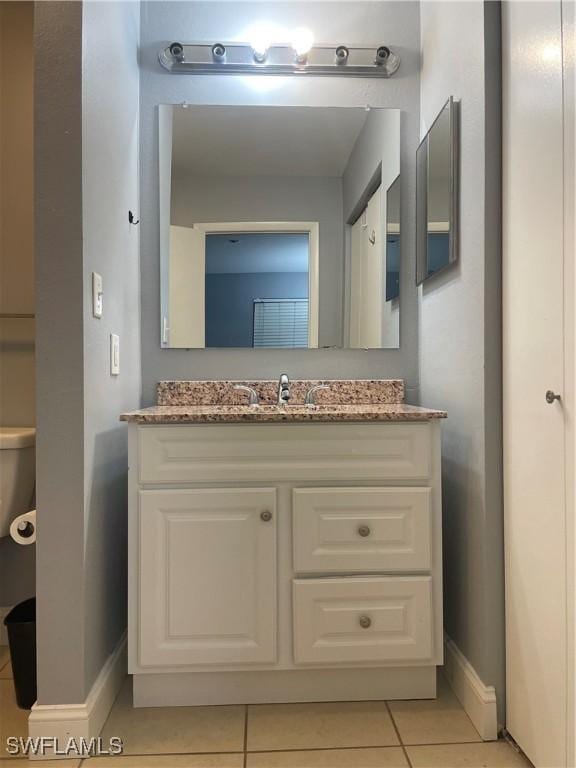 2925 Winkler Ave Unit 906, Fort Myers, FL 33916 - bathroom with baseboards, tile patterned floors, and vanity
