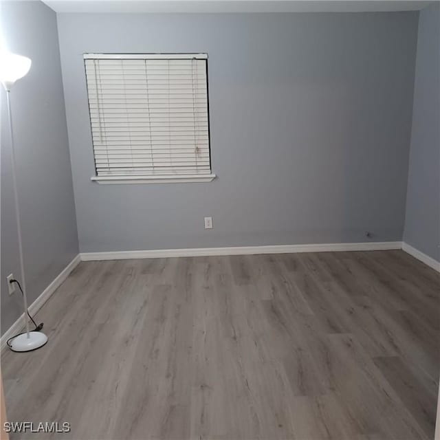 2925 Winkler Ave Unit 906, Fort Myers, FL 33916 - spare room with wood finished floors and baseboards